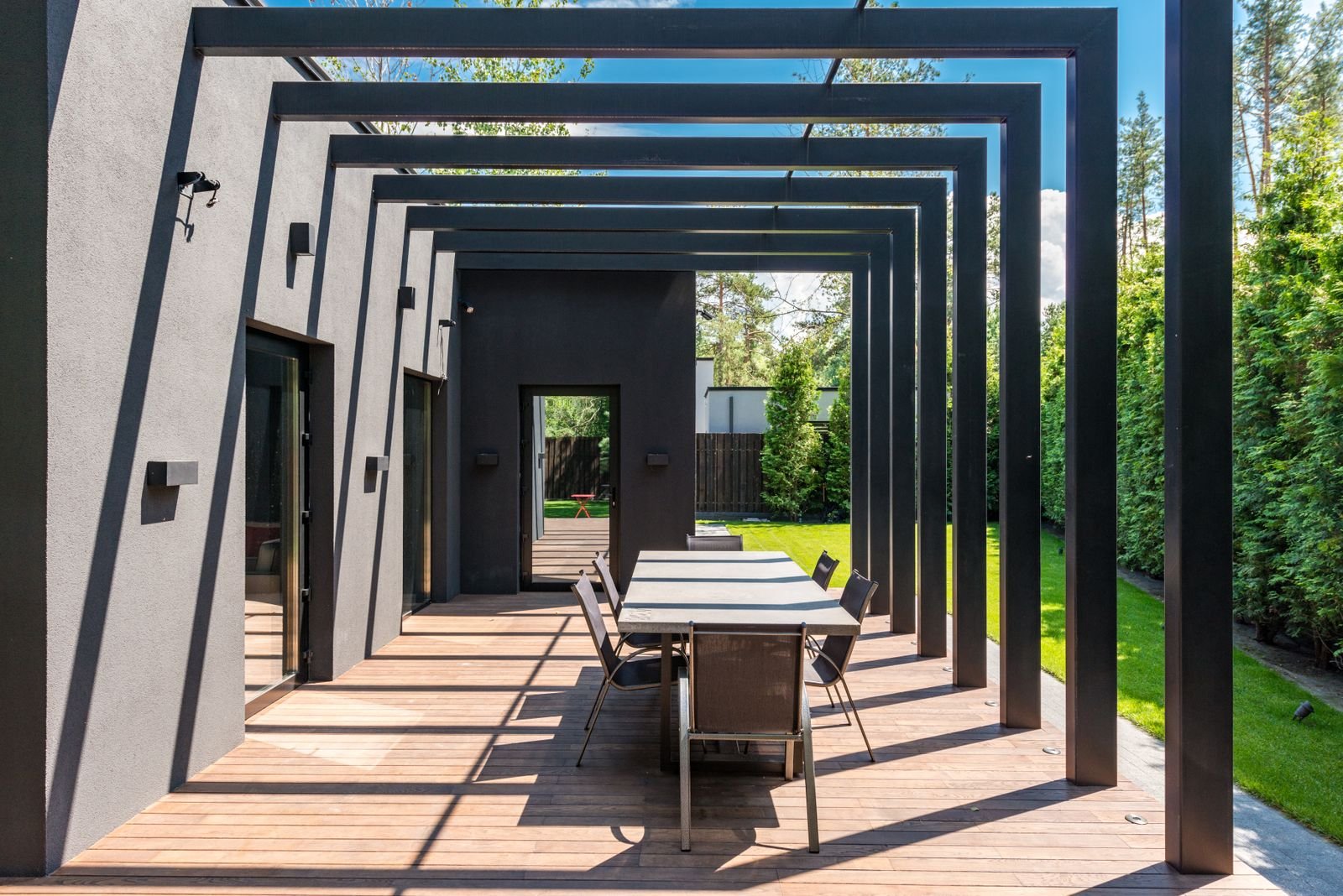Slatted pergola over an outdoor dining area